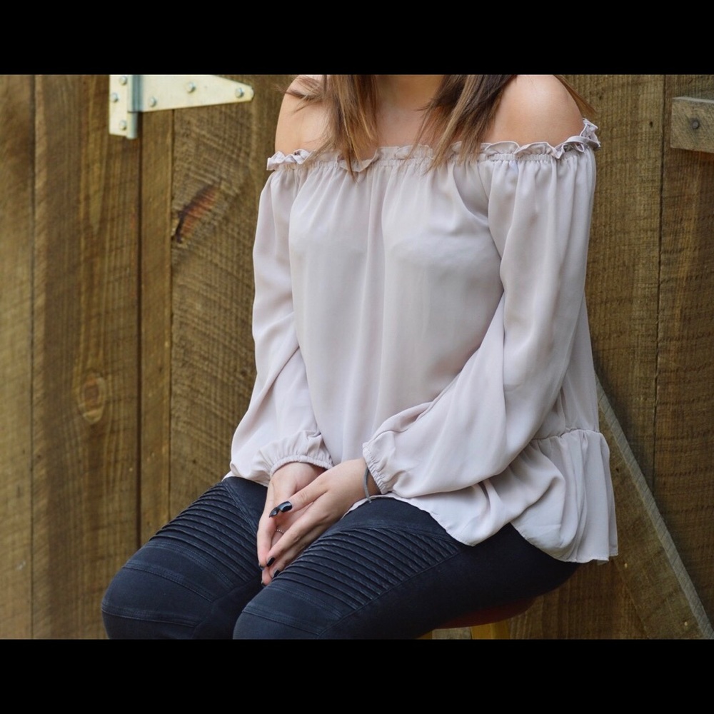 off the shoulder light pink shirt